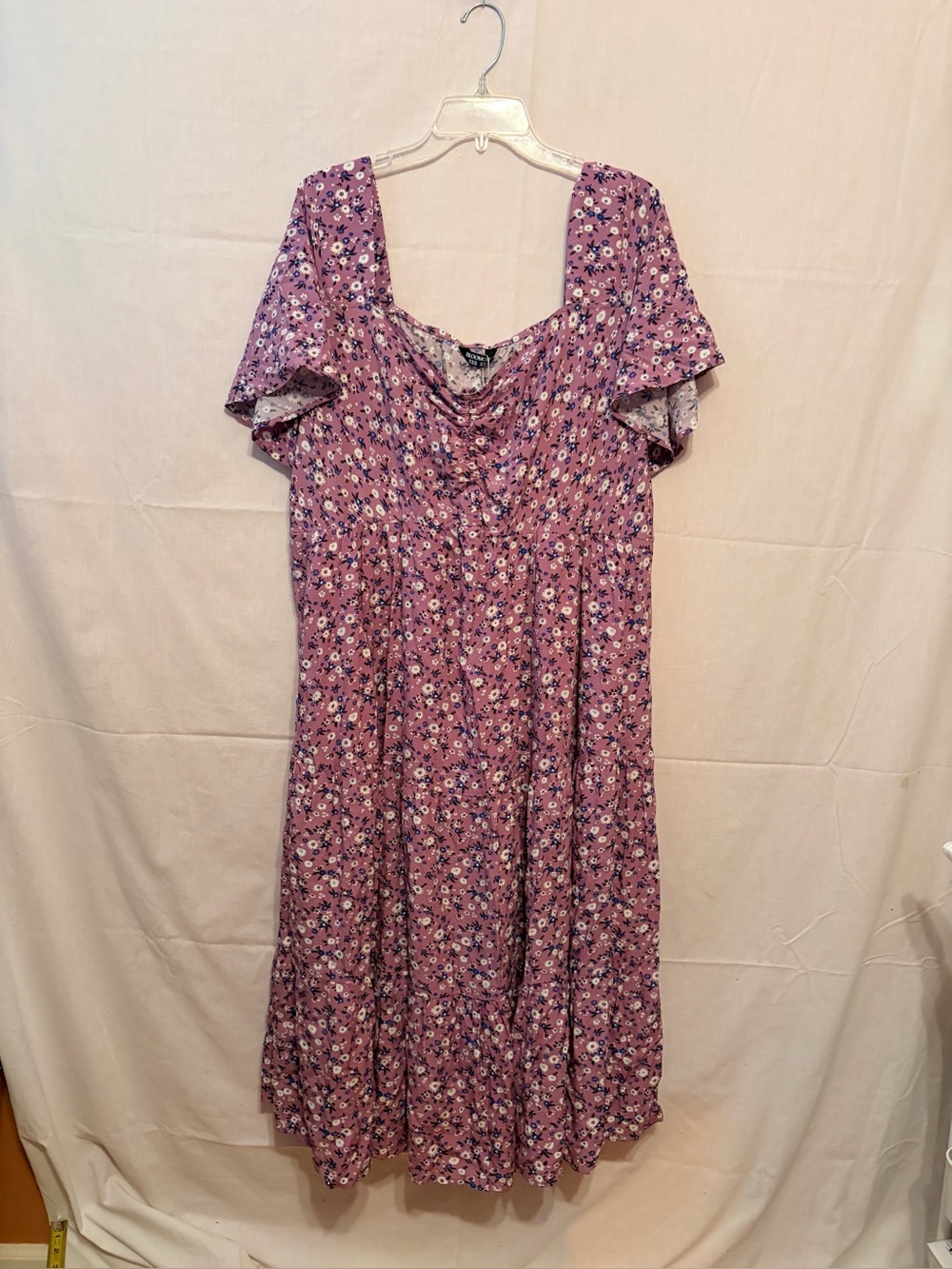 Bloomchic boho-style midi dress with a pink floral print, square neckline.